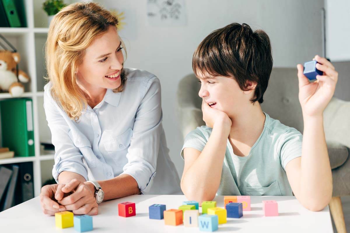early-signs-of-autism a mother plays with her son and wonders if he shows the early signs of autism