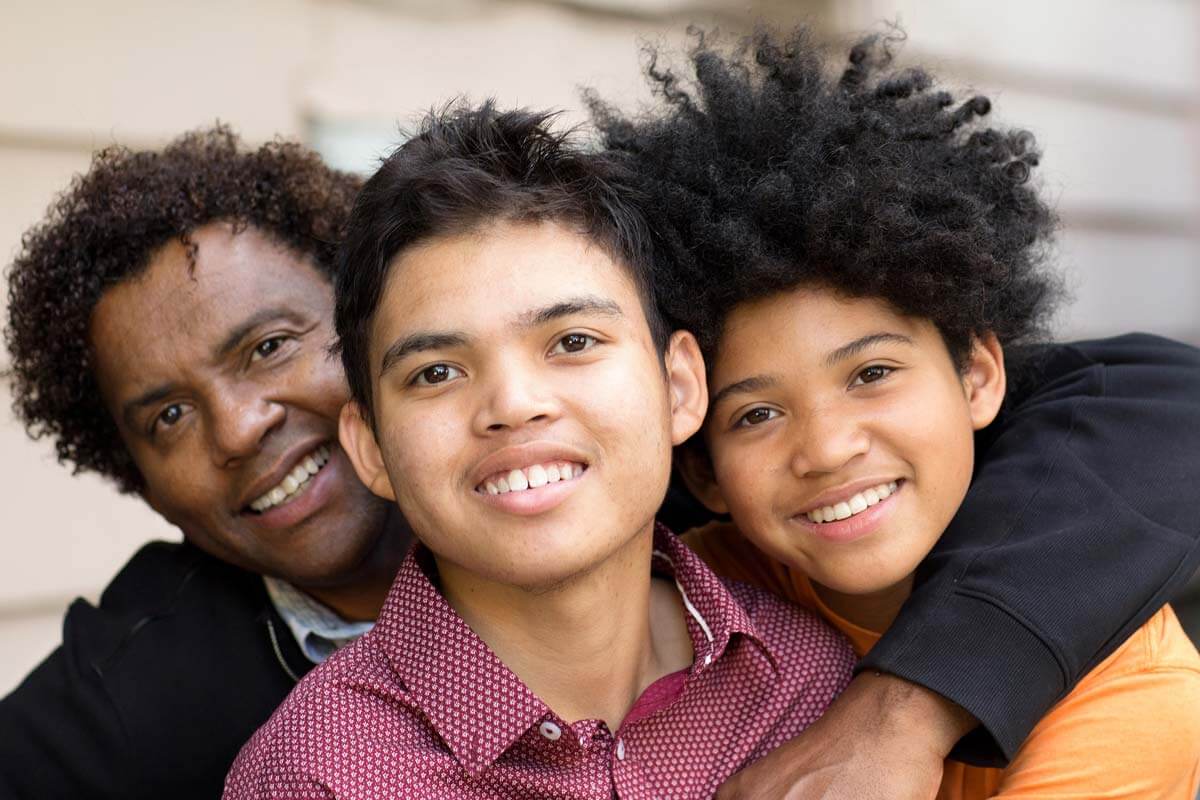 types-of-autism a family hugs after learning about the types of autism