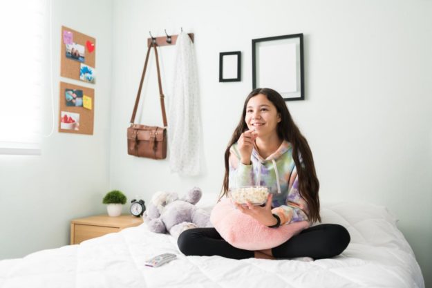 How to Set Boundaries With Your Autistic Child a girl watching a show about how to set boundaries with your autistic child