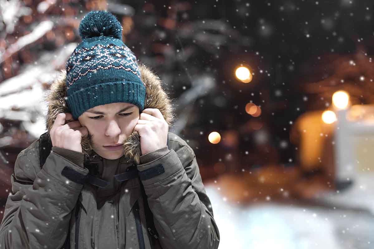 Holiday Stress and the Need for Alone Time young boy struggles with holiday stress
