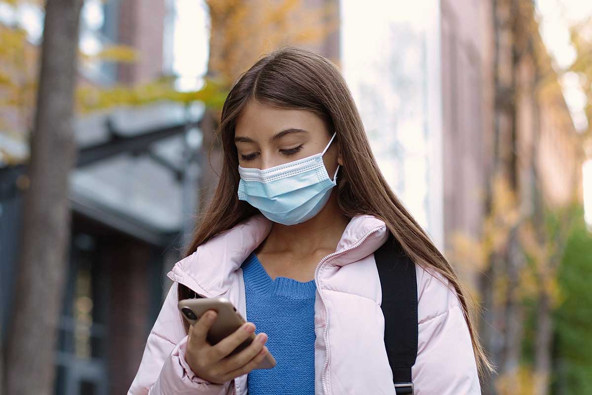 screen-time-and-coronavirus girl who is having increased screen time due to coronavirus