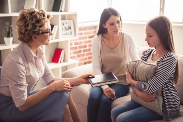 Increased Anxiety and Stress in an Isolated World a teen with autism is supported in therapy for stress management
