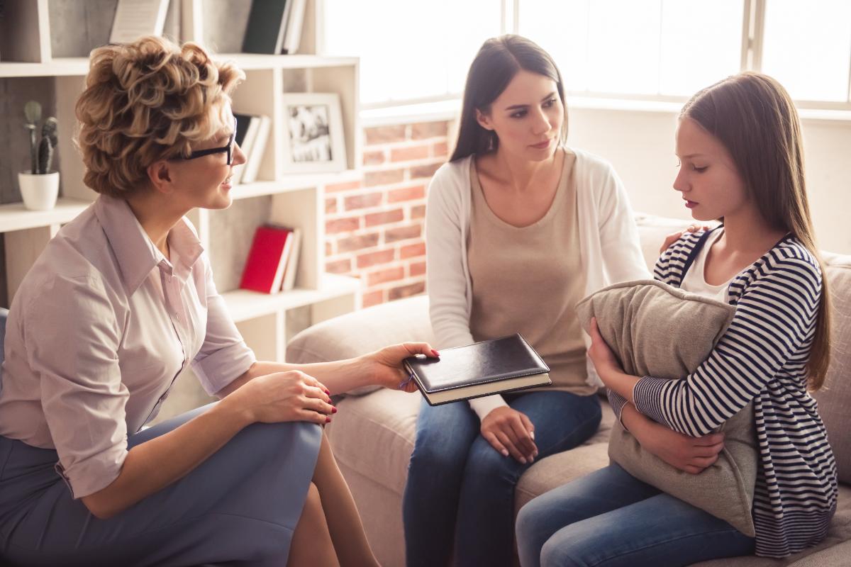 Increased Anxiety and Stress in an Isolated World a teen with autism is supported in therapy for stress management