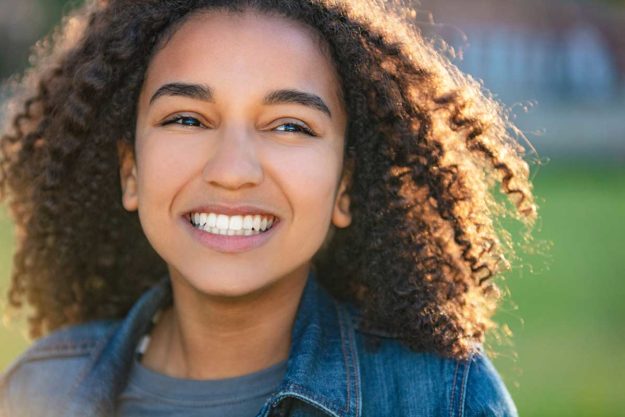 3-How-You-Can-Support-Autism-Treatment-Programs a woman is happy to be supporting autism