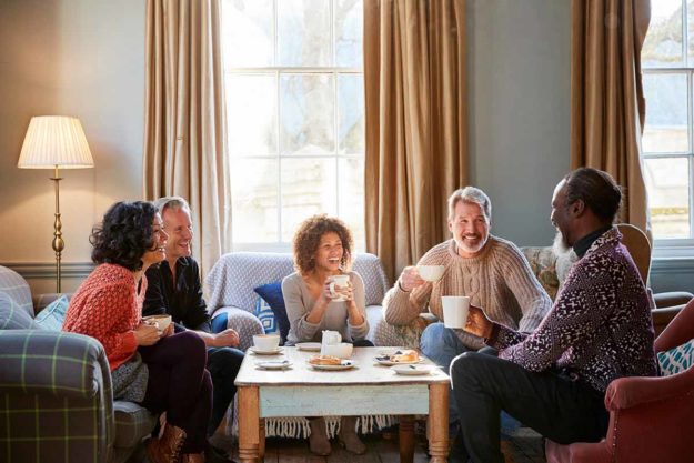 What-You-Need-To-Know-About-Autism-Parenting-Support-Groups-1 (1) people gather around for an autism parenting support groups