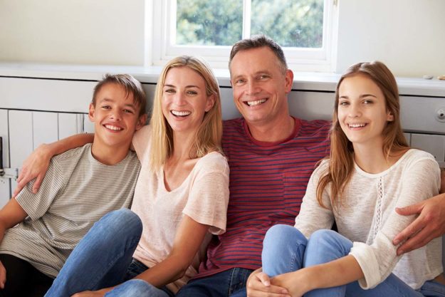 How Autism Parent Training Can Benefit the Whole Family a family smiles through their autism parent training
