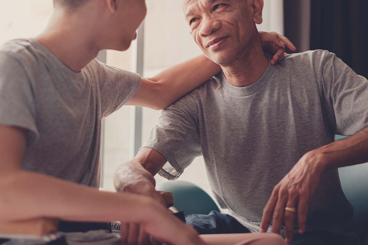 ABA Therapy and Anger Management for Children With Autism young male hugging adult male