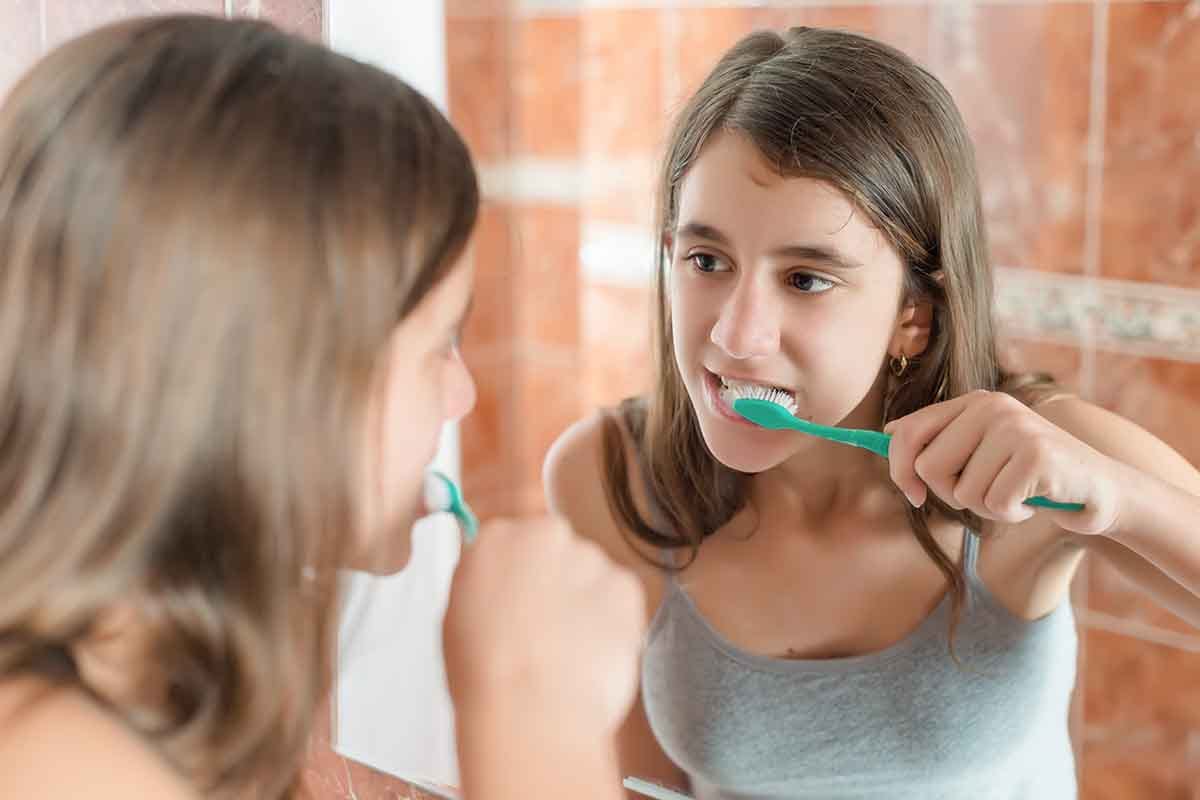 Teaching Self-Care Skills For Children With Autism child brushes teeth