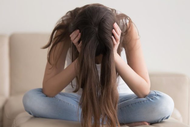 The Risk of Self-Harm in Children With Autism a girl struggling with self-harm in children with autism