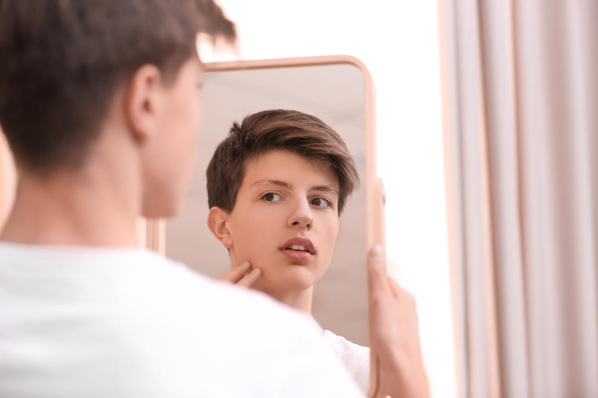Helping Autistic Children With Self-Care teen-looking-in-mirror-for-self-care