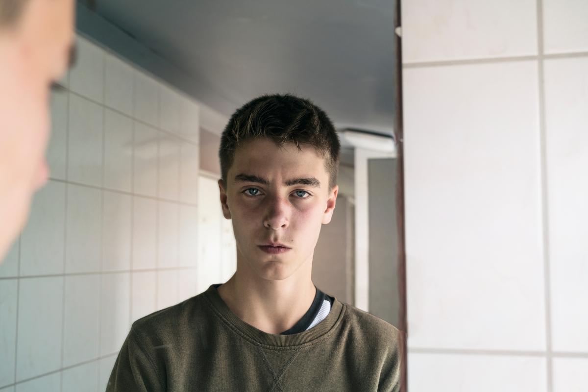 How To Manage Aggression In Kids With Autism teen-staring-while-thinking-about-aggression-in-kids-with-autism