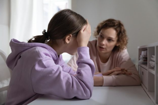 What is Anger Rumination for Children With ASD a parent helps her daughter calm down from anger rumination