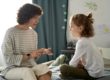 mother demonstrates with daughter how helping your kids develop communication skills is essential